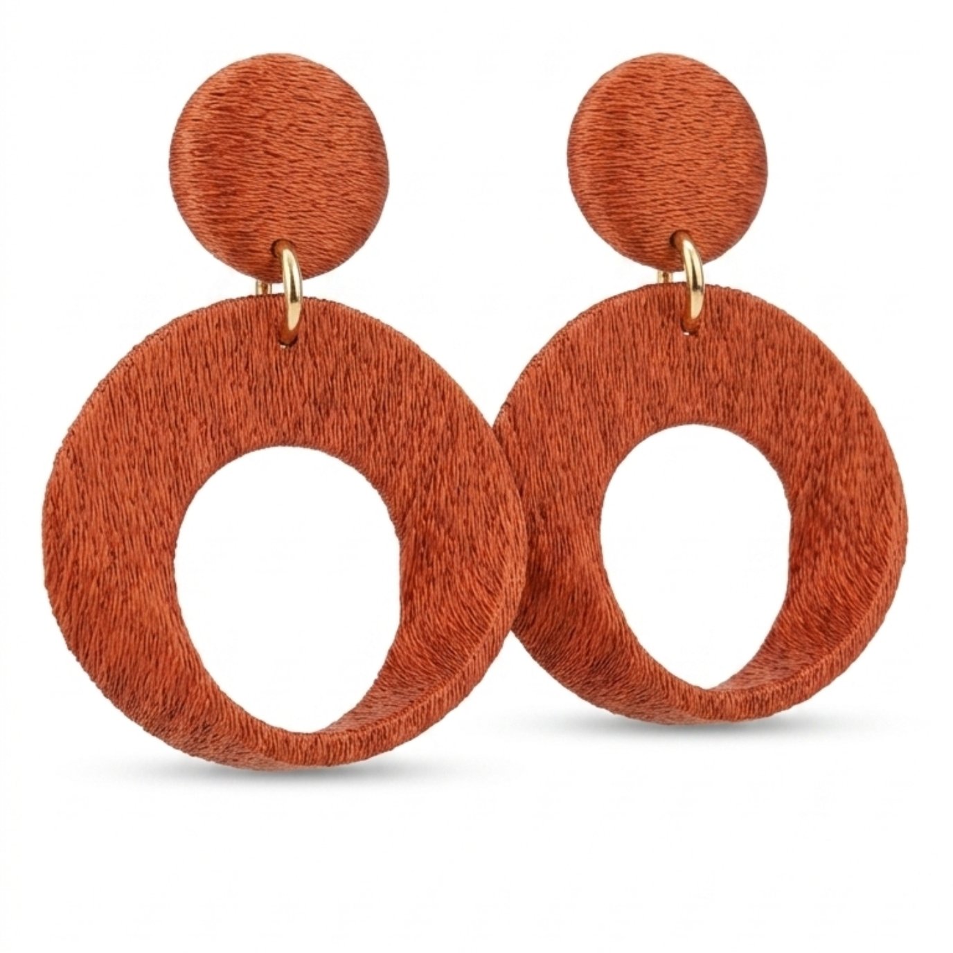 Close-up of oversized imperial earrings showing modern thick structure