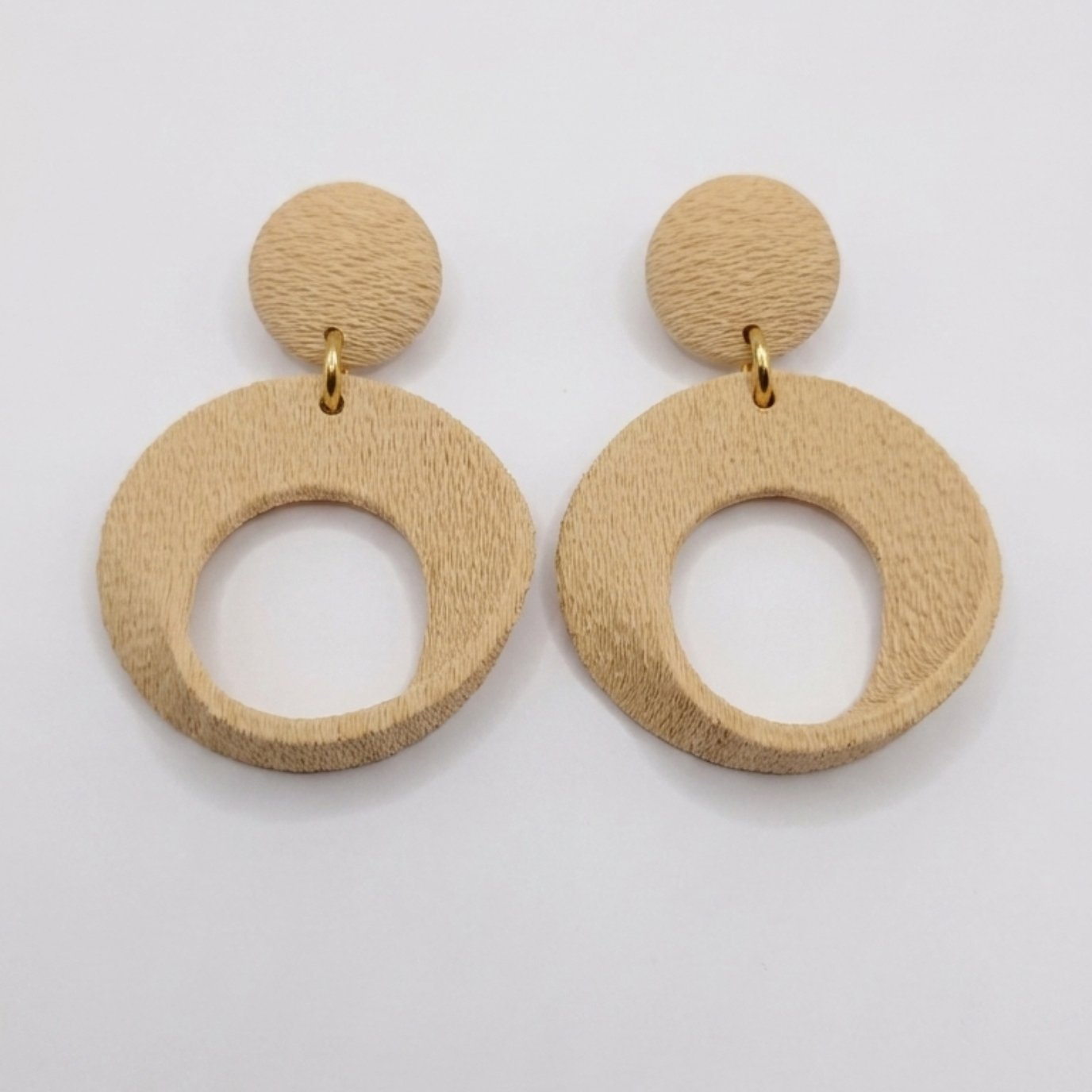 Side view of extra large sculptural imperial earrings design