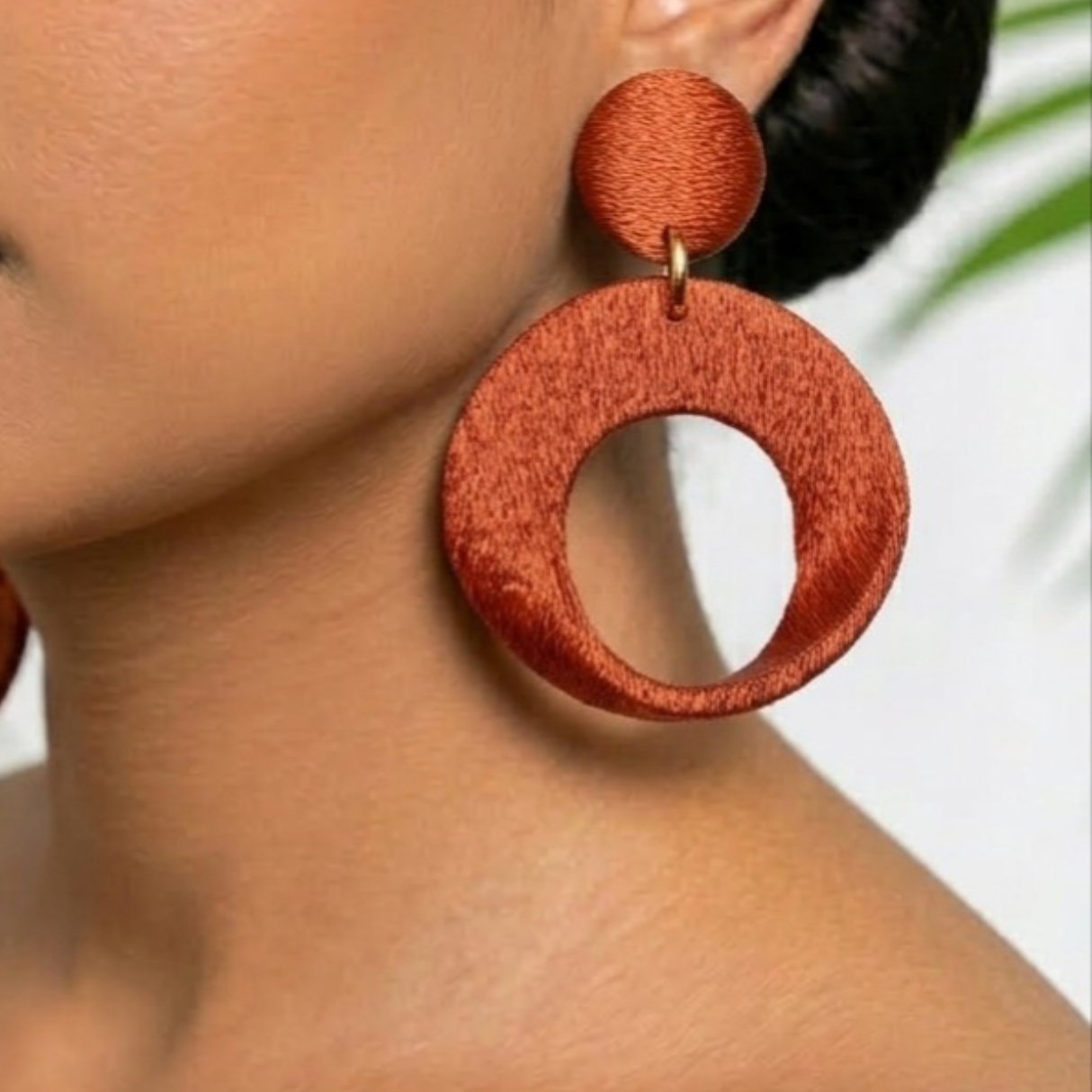 Imperial XL statement earrings worn on model for scale reference